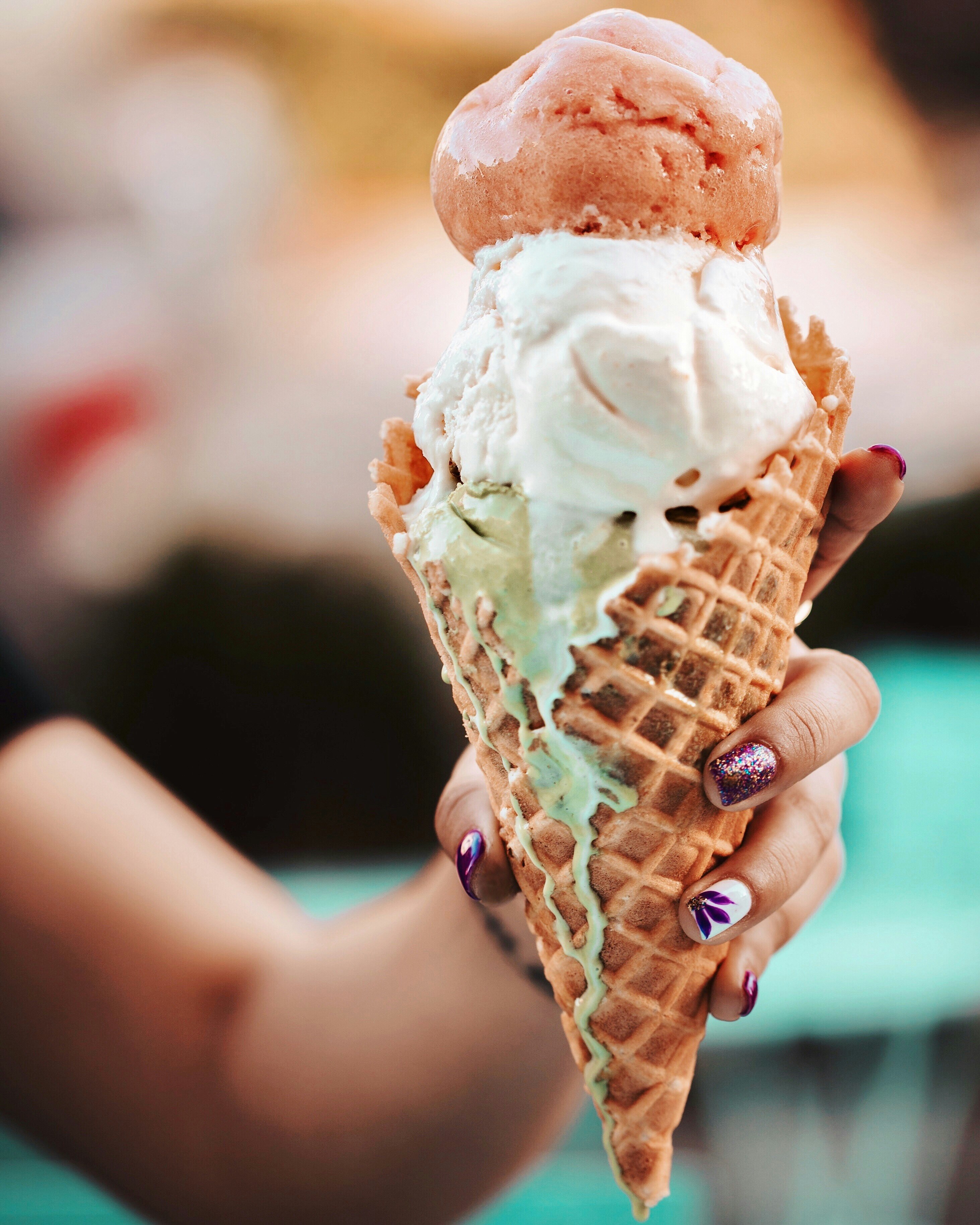 person holding ice cream cone